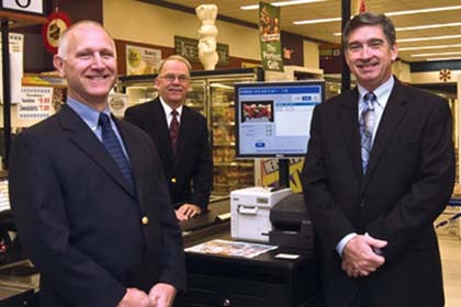 From left to right Joe Jurich, CTO DUMAC with RORC customers Ron Monahan, owner of Foodland and Glenn Kriczky, VP Information Systems at AWI